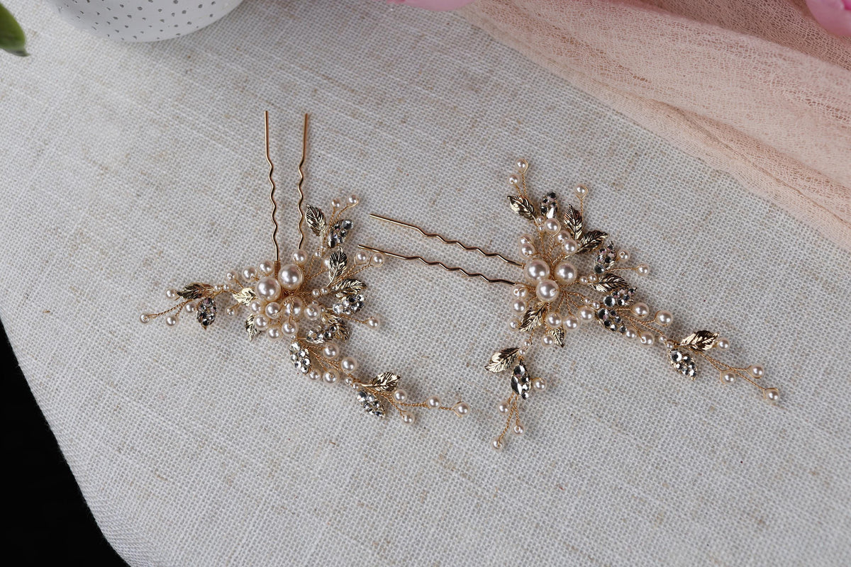 a pair of hair pins sitting on top of a table