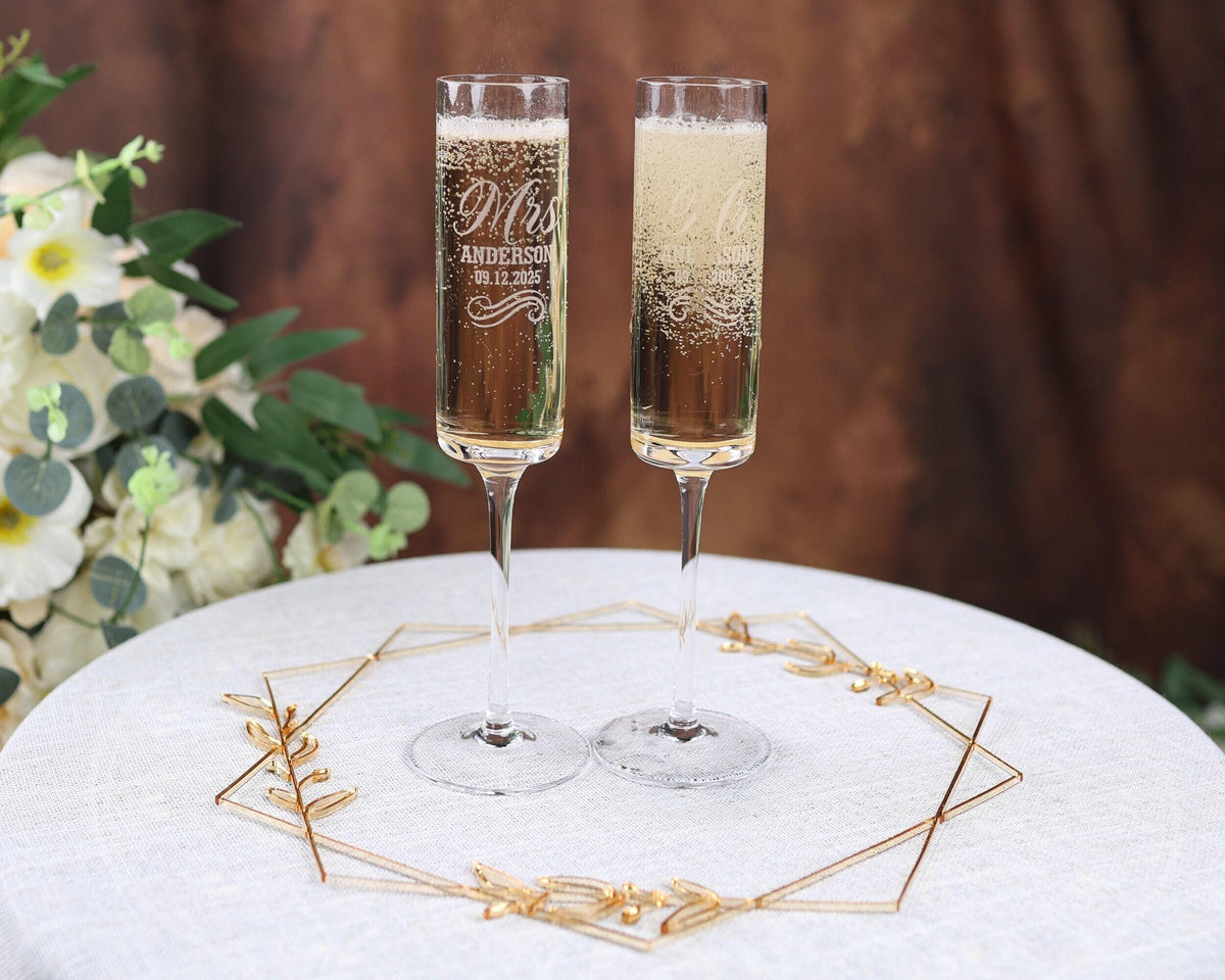 a couple of champagne flutes sitting on top of a table