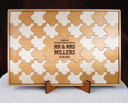 a wooden puzzle with a couple's initials on it