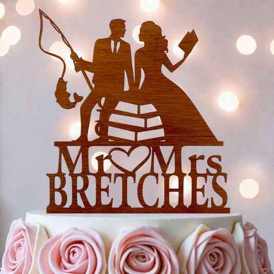 A wooden wedding cake topper with the names 'Mr. and Mrs. Breches' written on it.
