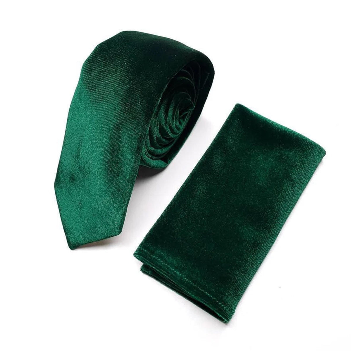 A dark green velvet tie and a dark green velvet napkin are displayed against a white background.
