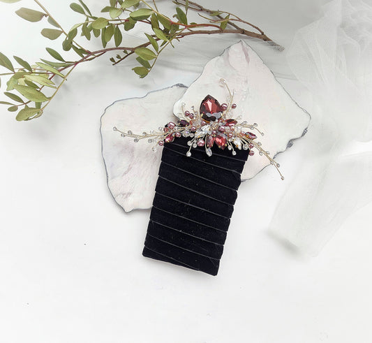 a hair comb with a flower on top of it