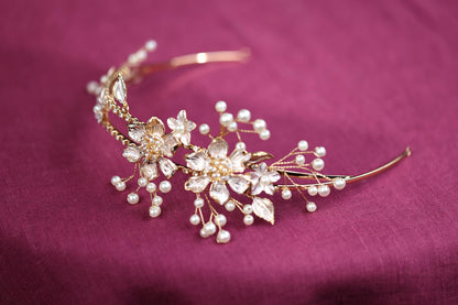 a close up of a tiara on a purple cloth