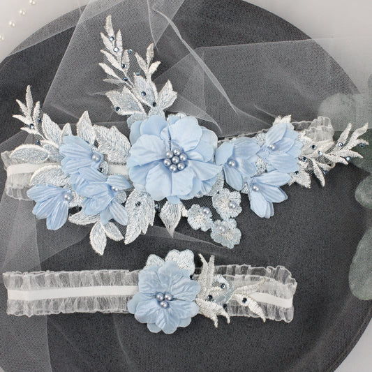 a couple of blue flowers on top of a black plate