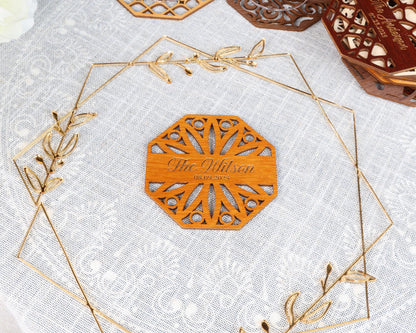 a wooden plaque with a name on it sitting on a table