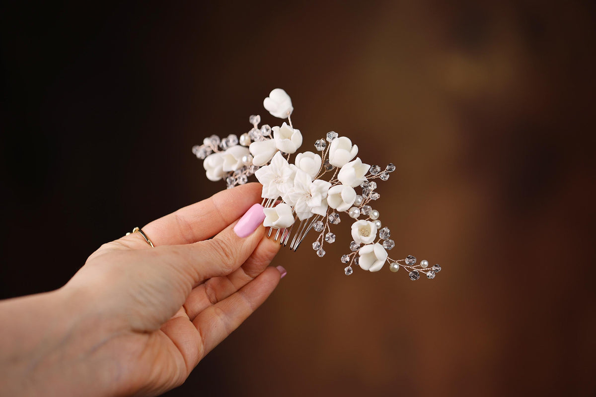 a person holding a bunch of flowers in their hand