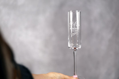 a woman holding a wine glass in her hand