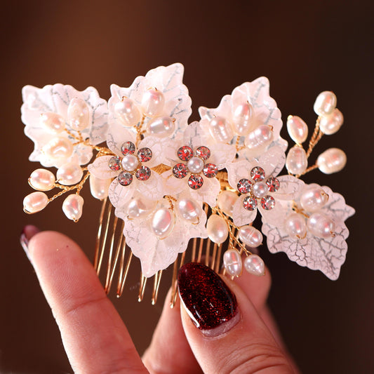 a close up of a person holding a hair comb
