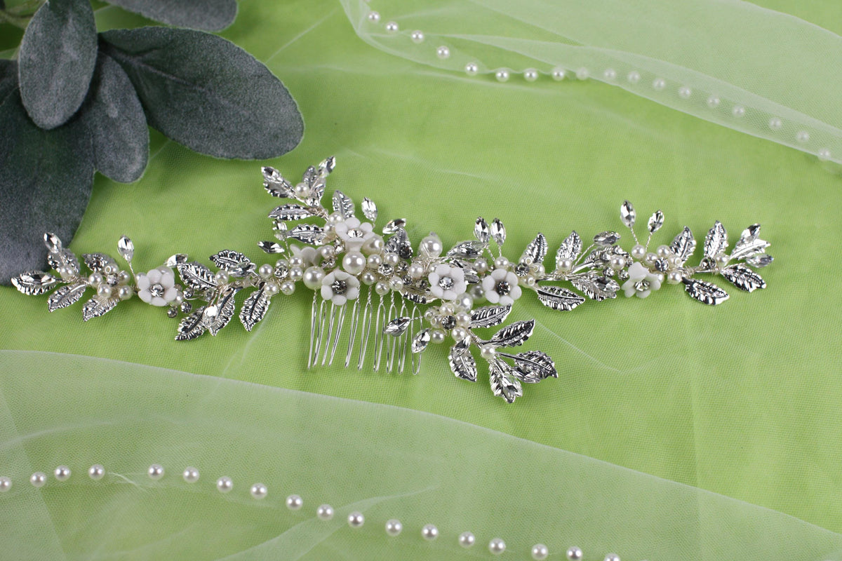 a close up of a hair comb on a green cloth