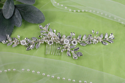 a close up of a hair comb on a green cloth