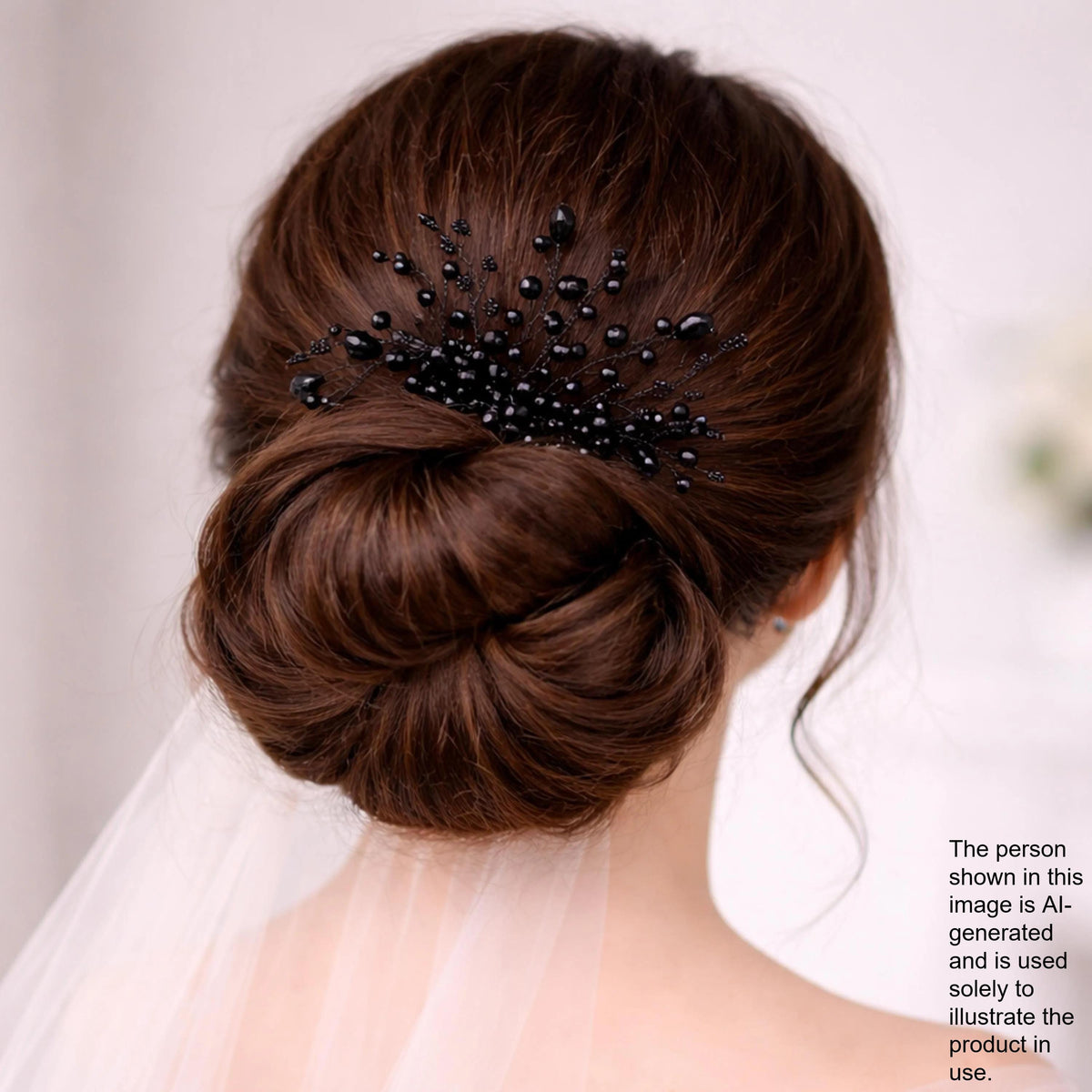 the back view of a woman's head with her hair styled in a bun, adorned with a decorative hair accessory featuring black beads.