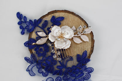 a piece of wood with blue lace and flowers on it