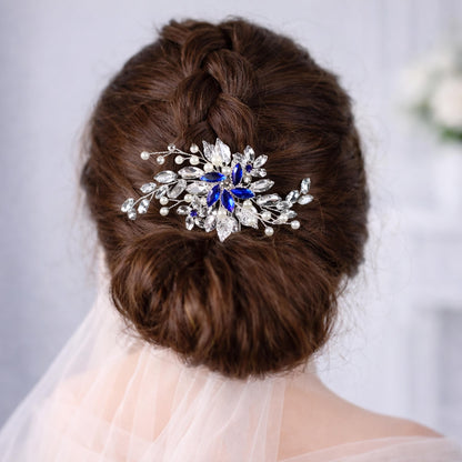 a close-up view of a woman's back, focusing on her hair and a decorative hair accessory.