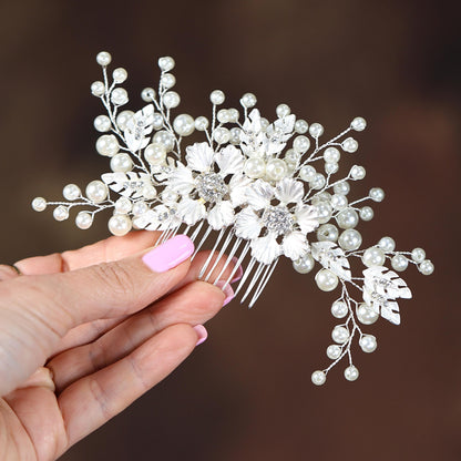 a woman holding a hair comb in her hand