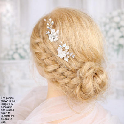 A close-up of a woman's blonde hair styled in a bun with decorative flower hair clips.