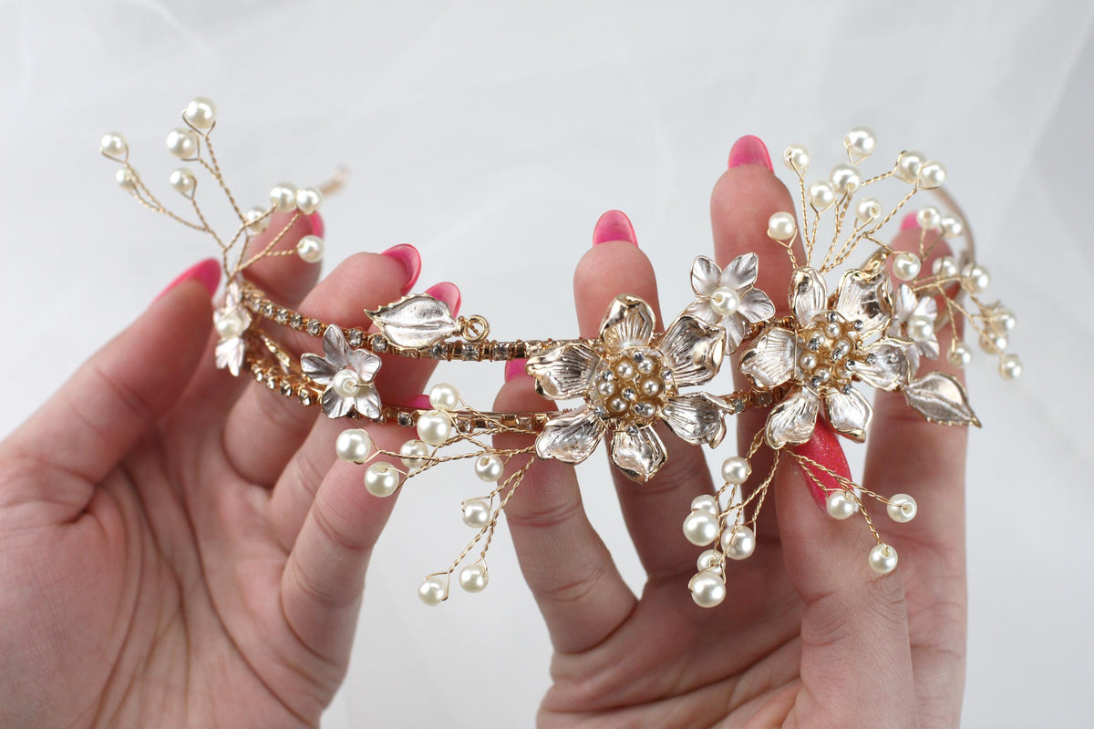 a close up of a person holding a tiara