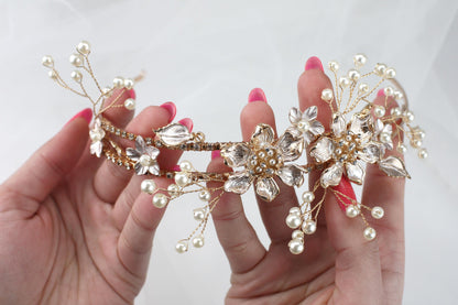 a close up of a person holding a tiara