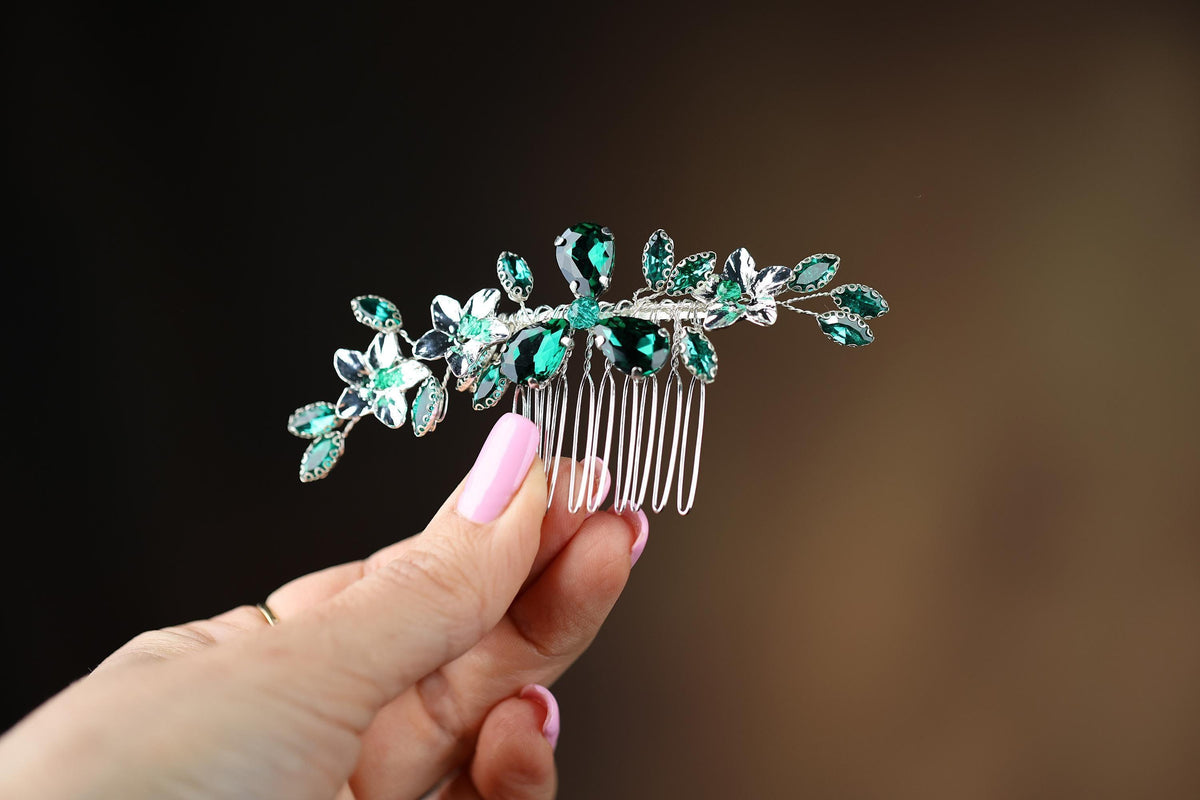 a close up of a person holding a hair comb