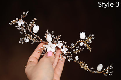 a woman is holding a white flower headpiece