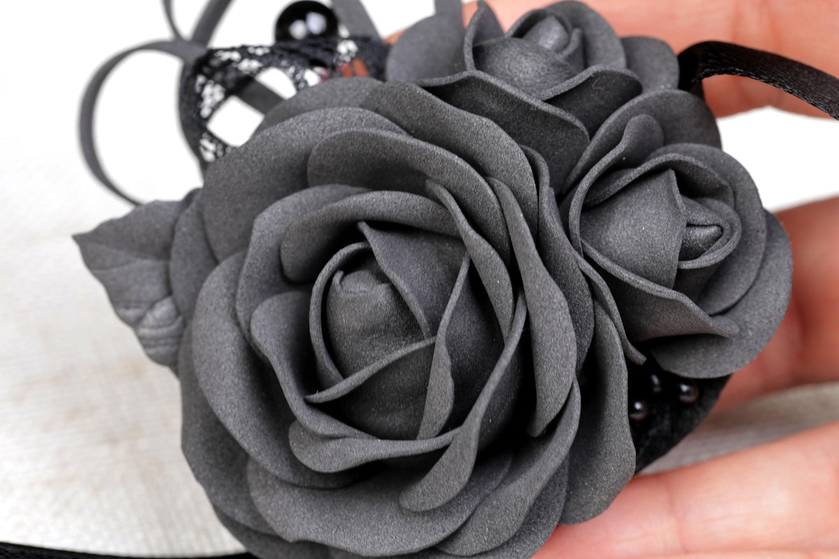 a close up of a person holding a flower
