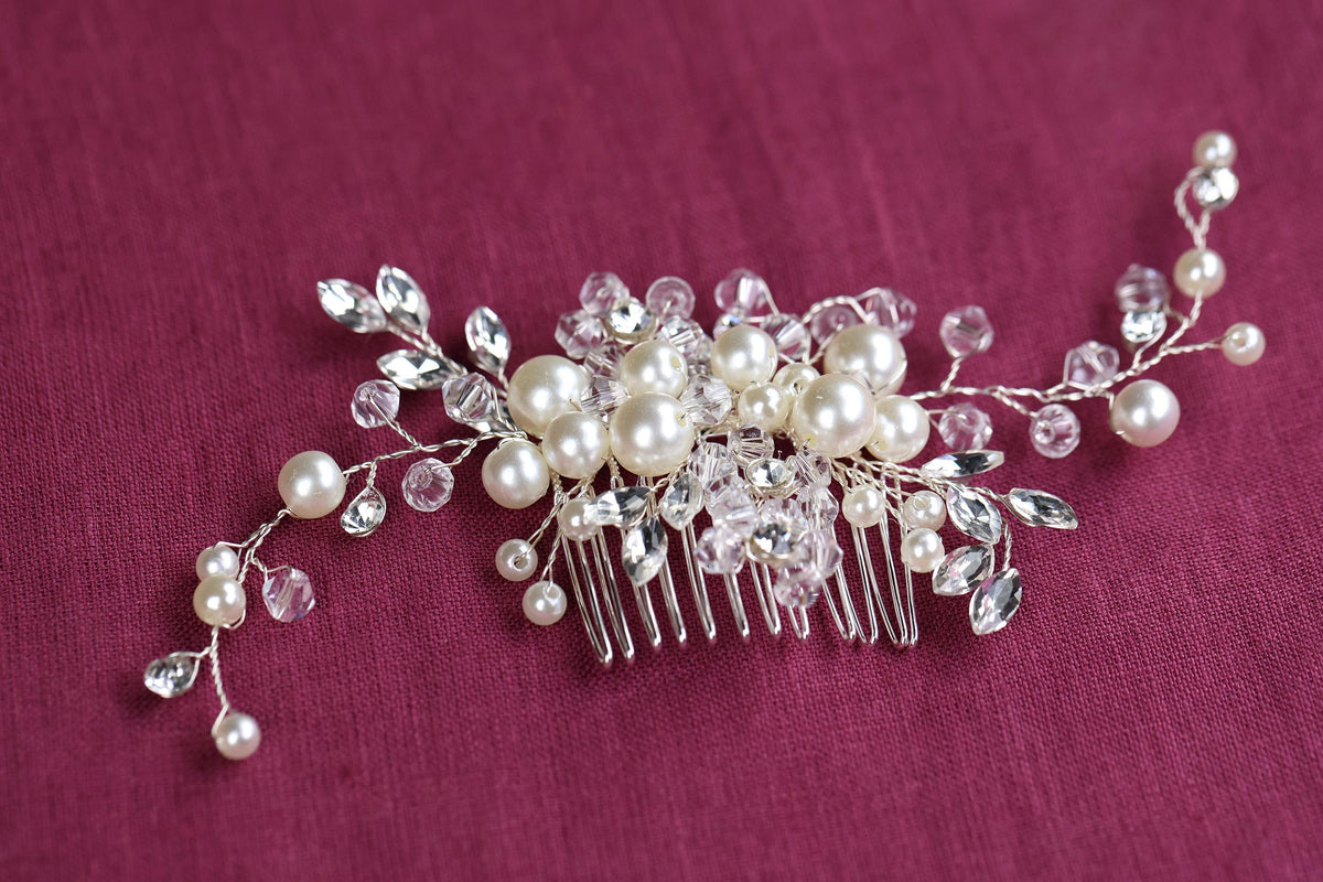 a close up of a hair comb with pearls