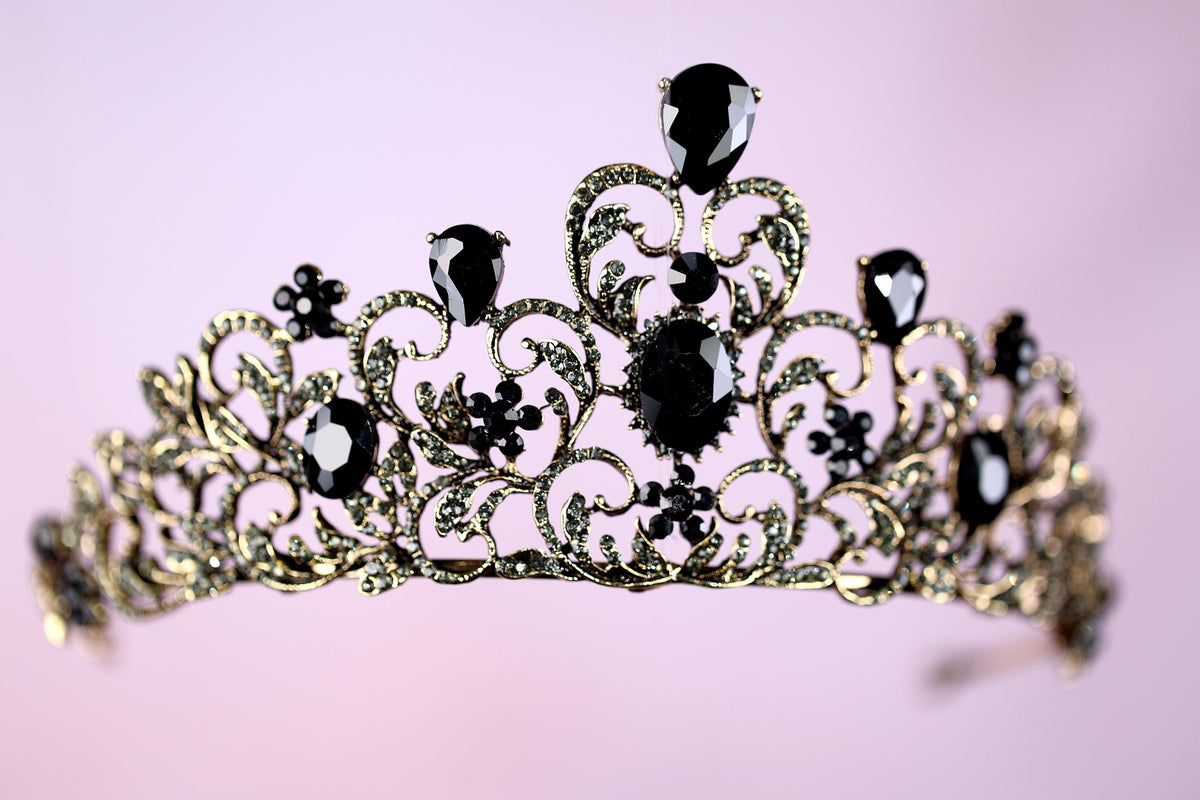 a tiara with black and white jewels on it