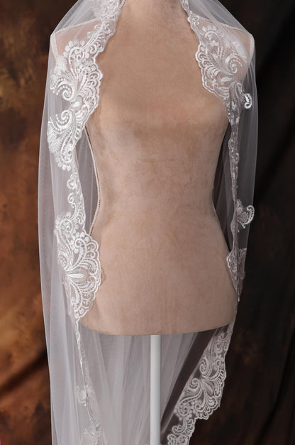 a mannequin with a veil on top of it