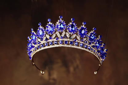 a tiara with a lot of blue stones on it