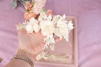 a woman's hand holding a bunch of flowers
