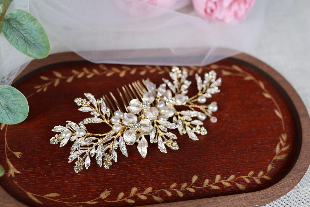 a close up of a hair comb with flowers in the background