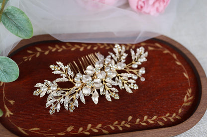 a close up of a hair comb with flowers in the background