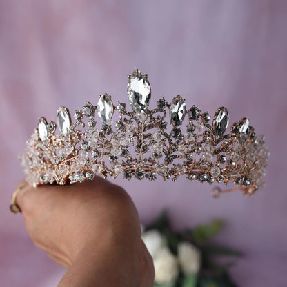 a person holding a tiara in their hand