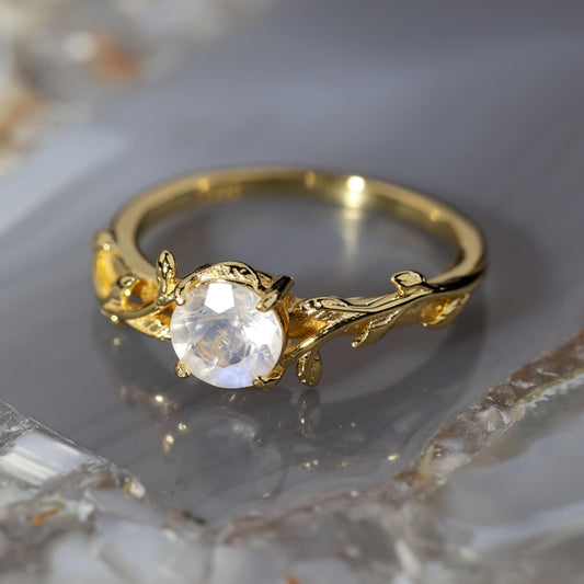a close up of a ring on a marble surface