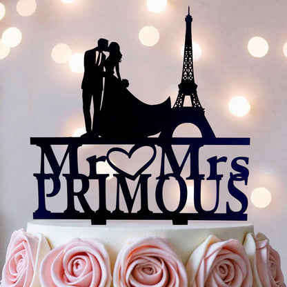 A silhouette of a couple embracing in front of the Eiffel Tower, with the words "Mr. Primous" written below.