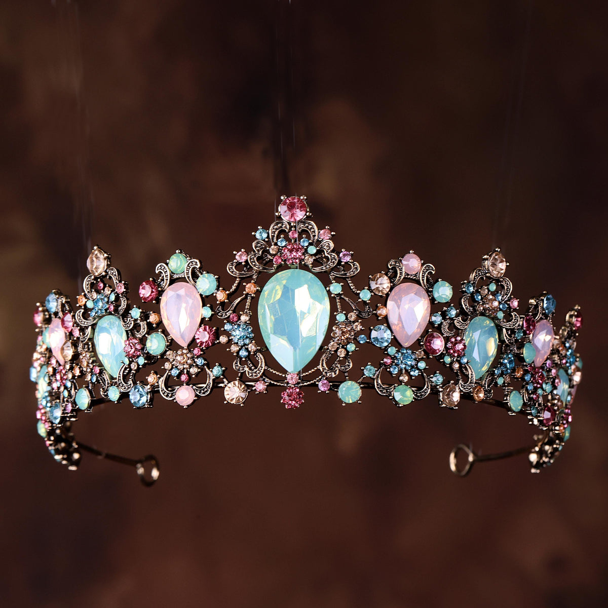 a tiara is adorned with jewels and pearls