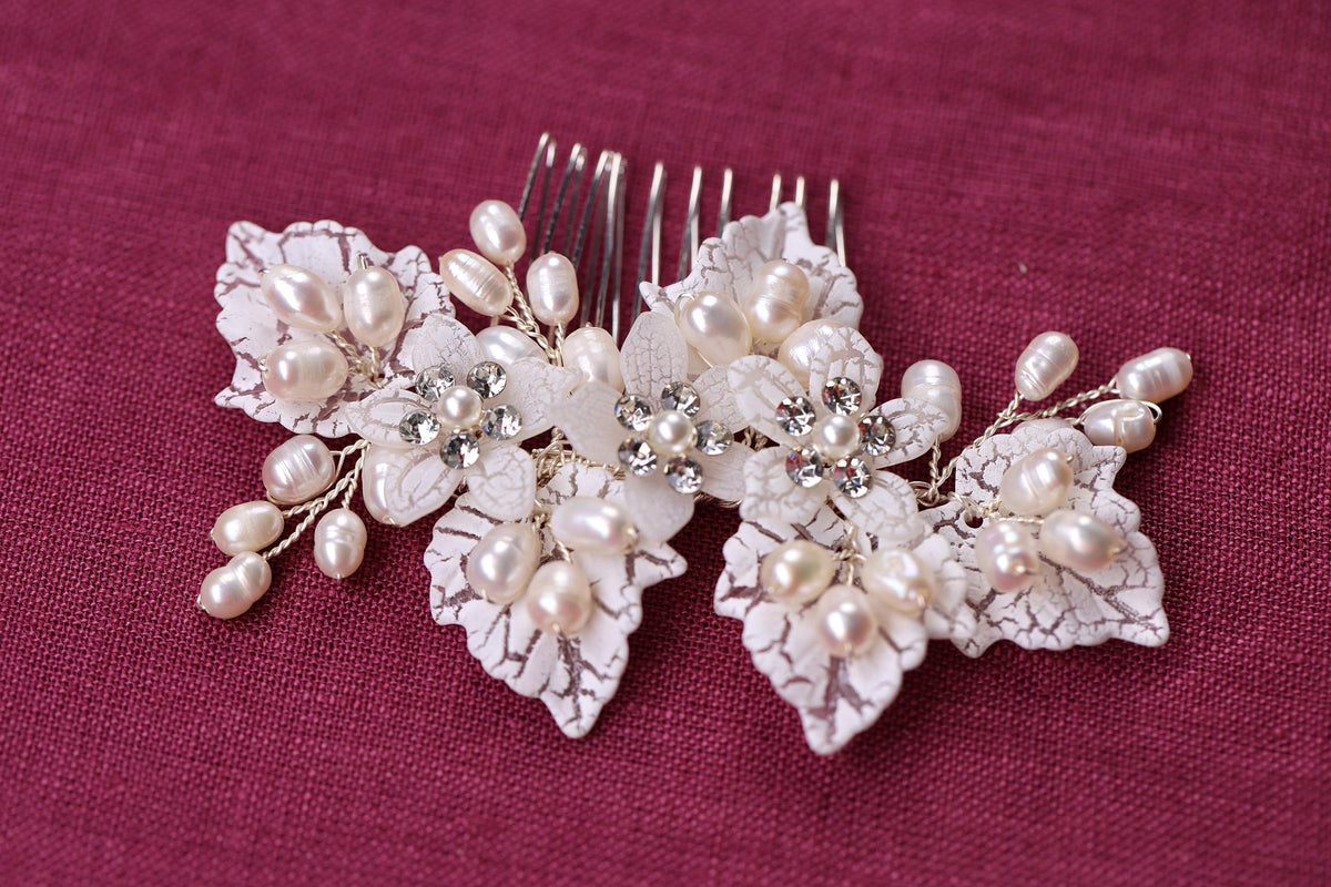 a close up of a hair comb with flowers on it