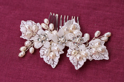 a close up of a hair comb with flowers on it