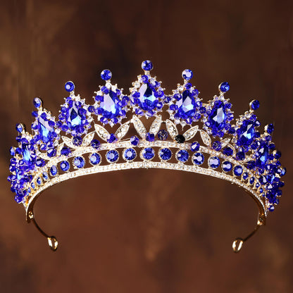 a tiara with a lot of blue stones on it