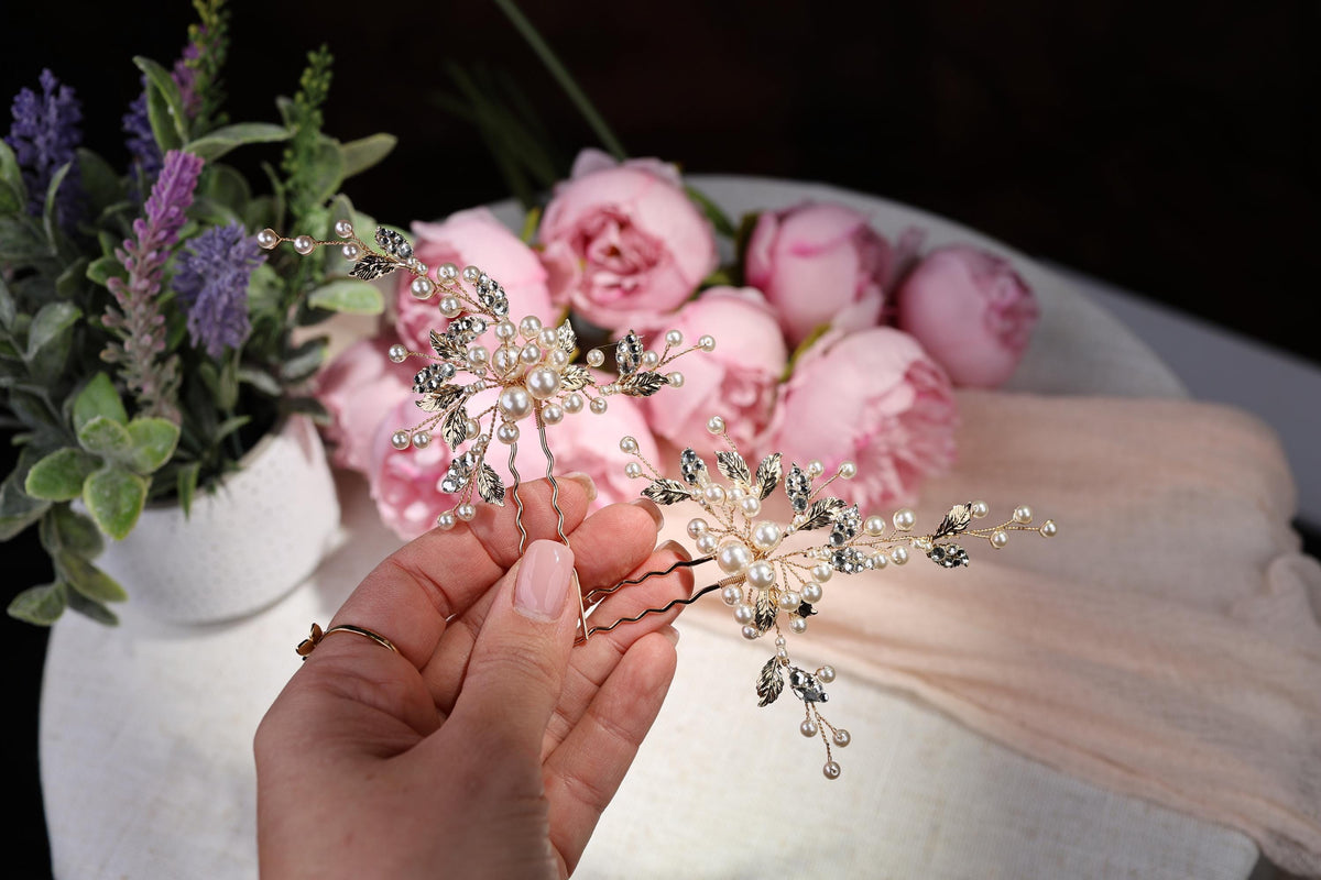a person holding a flower in front of a bouquet of flowers