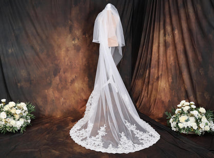 a bridal gown and veil on a mannequin