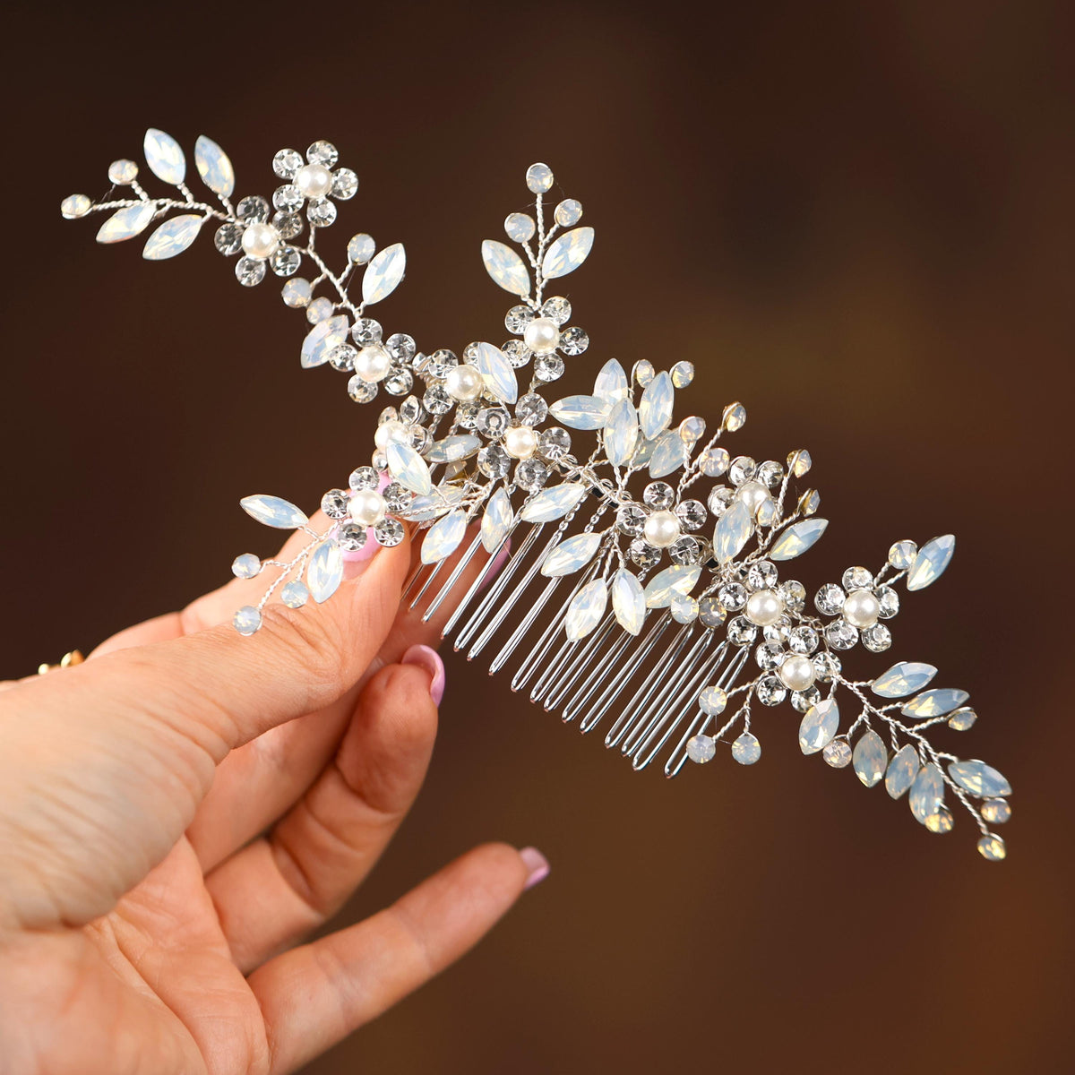 a close up of a person holding a hair comb