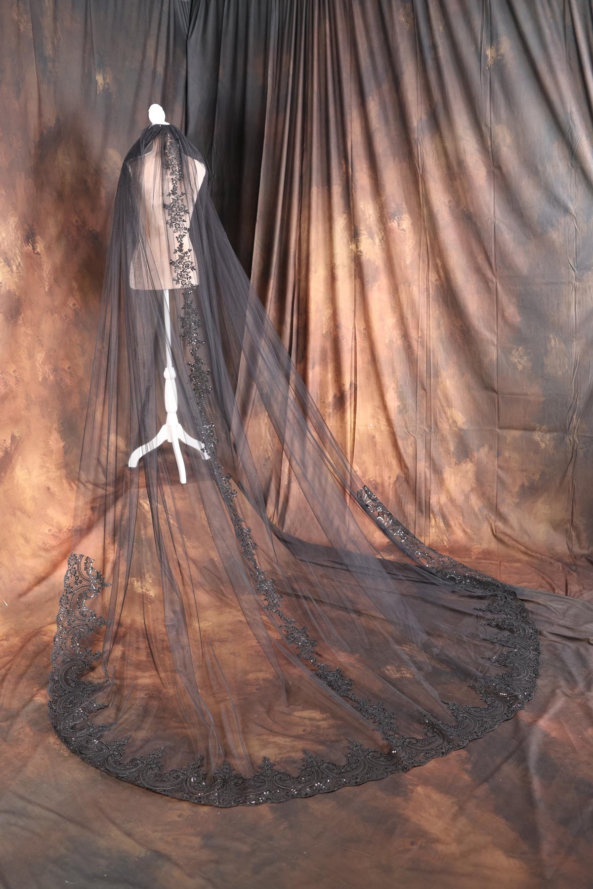 a mannequin dressed in a wedding dress with a veil