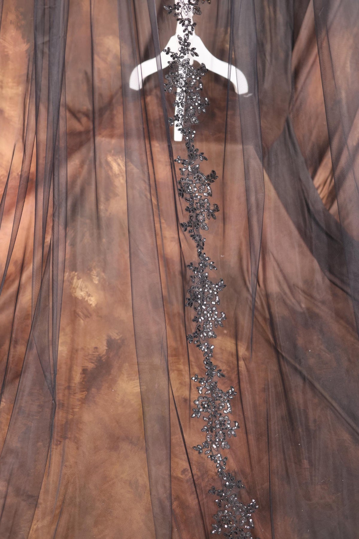 a dress on a mannequin with sequins on it