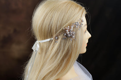 a woman's head wearing a bridal hair piece
