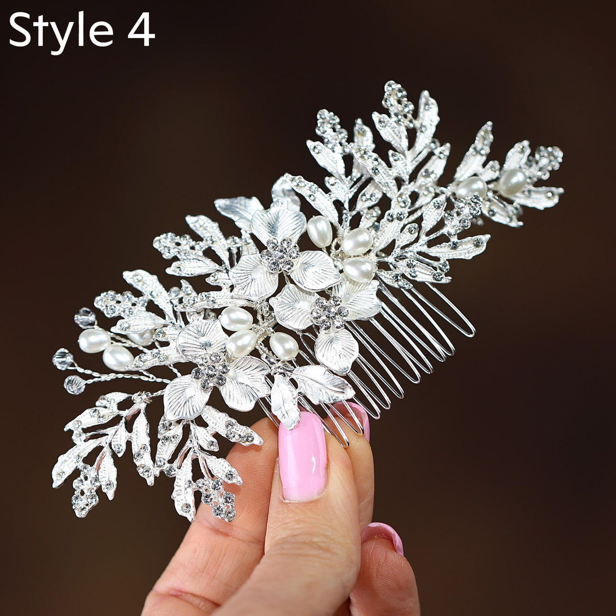 a close up of a person holding a hair comb