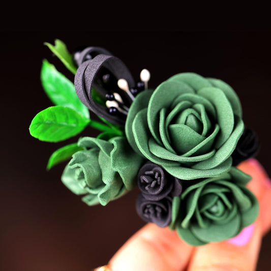 a close up of a person holding a fake flower