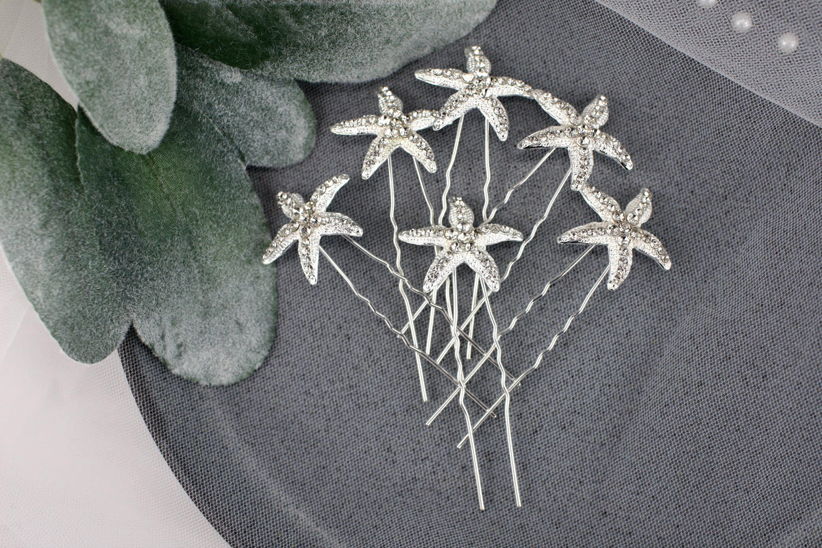 a bunch of pins sitting on top of a table