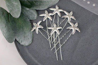 a bunch of pins sitting on top of a table