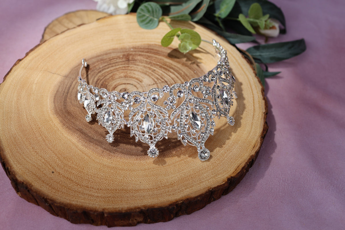 a close up of a piece of wood with a tiara on it