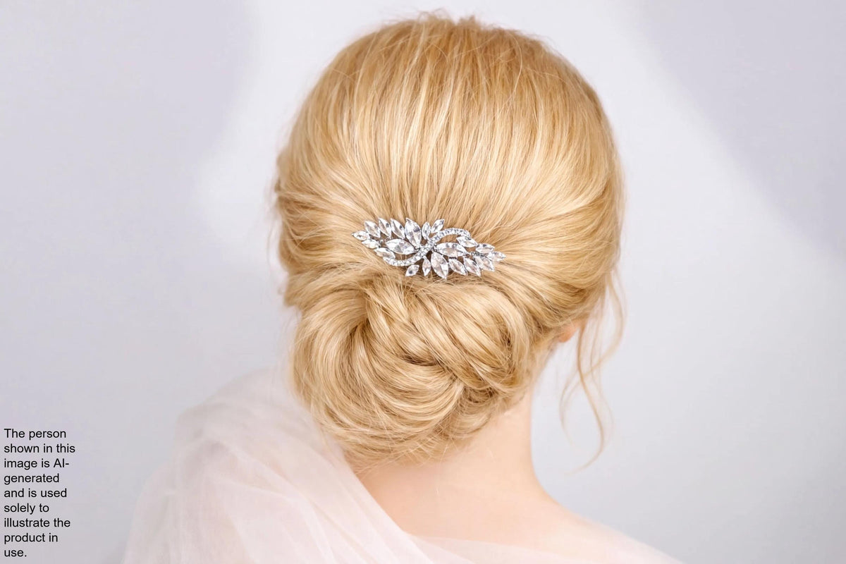 A close-up view of a woman's blonde hair with a decorative hair accessory, such as a flower or crystal piece, in the back of her head.